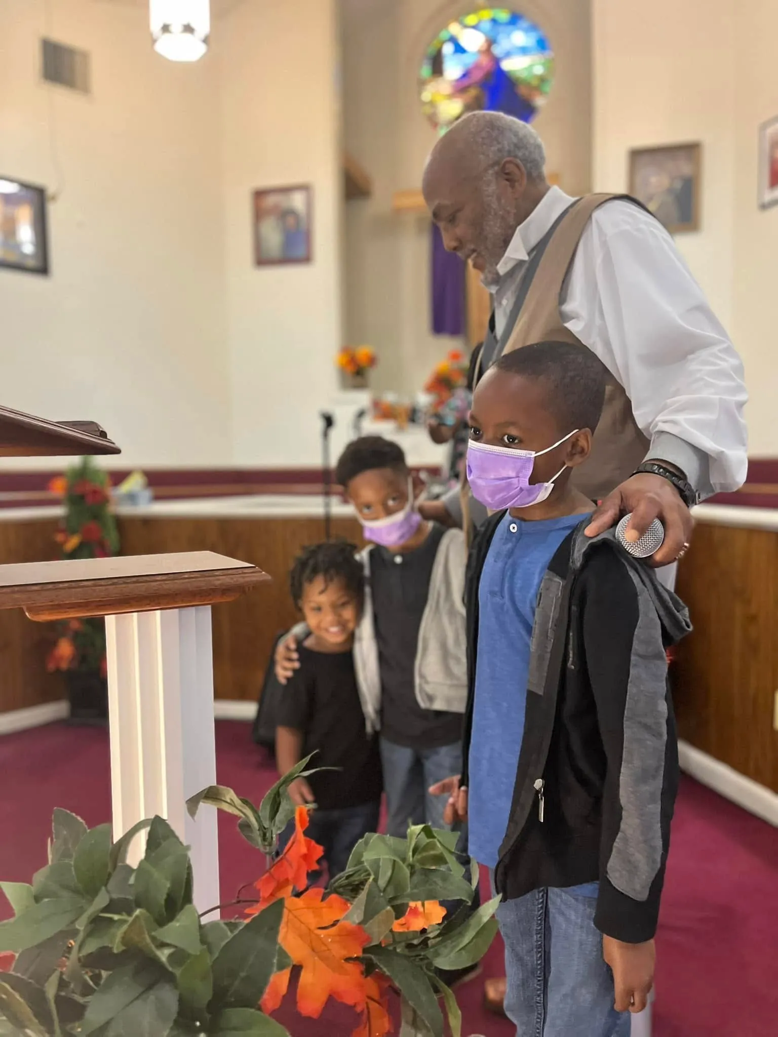 Blessing students and their backpacks before the school year