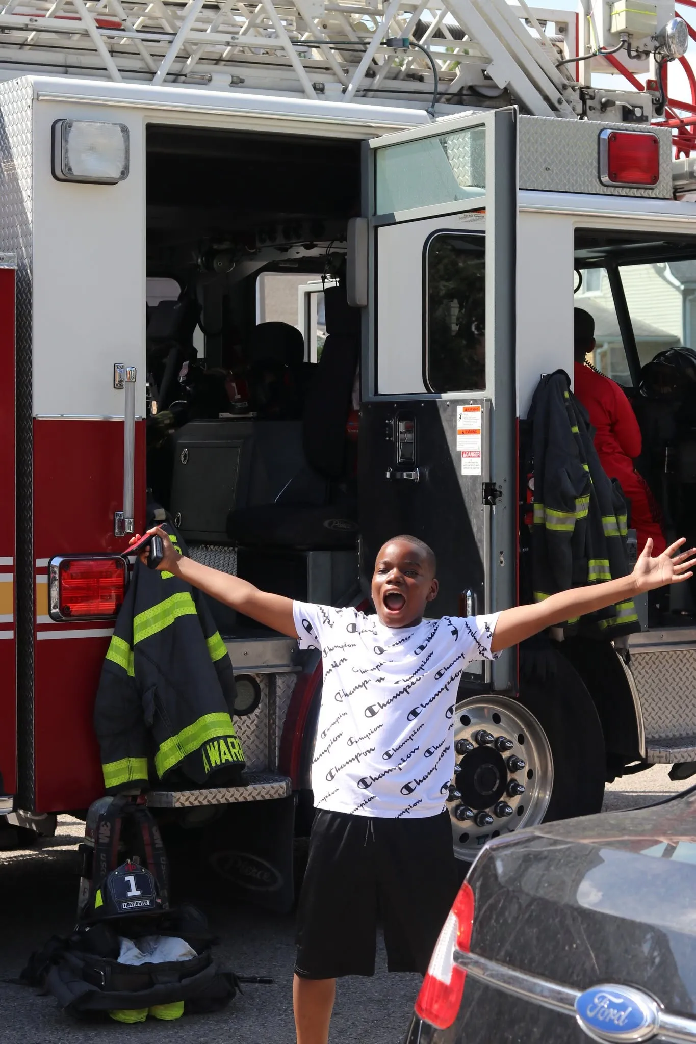 A young neighbor celebrating at the church's community day